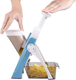 Person using vegetable chopper slicer cutting onions with adjustable thickness control kitchen mandoline