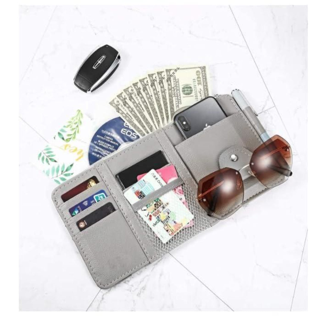 Professional driver using car visor organizer for business cards documents and essentials